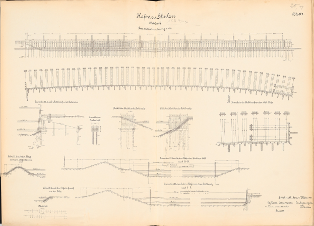 Offenes Buch mit detaillierten Zeichnungen und Text eines Eisenbahnsystems, einschließlich einer Illustration einer Eisenbahnschiene.